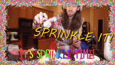 Man In Plaid Shirt Sprinkling Cake GIF