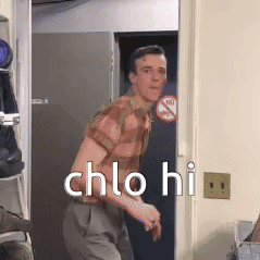 Man In Plaid Shirt Standing In Doorway GIF