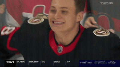 Man In Plaid Shirt Standing Next To Man In Red Jacket GIF
