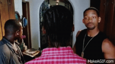 Man In Plaid Shirt Talking To Another Man GIF