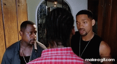 Man In Plaid Shirt Talking To Another Man GIF