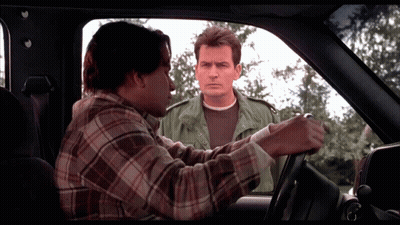 Man In Plaid Shirt Talking To Another Man In Car GIF