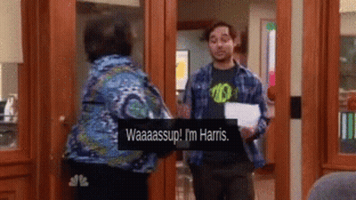 Man In Plaid Shirt Talking To Woman In Blue GIF