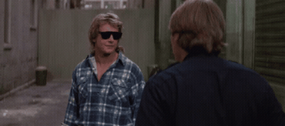 Man In Plaid Shirt Talks To Man In Blue Shirt GIF