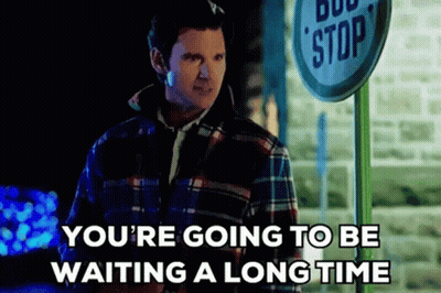 Man In Plaid Shirt Waiting At Bus Stop GIF