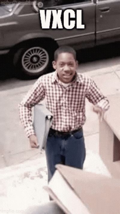 Man In Plaid Shirt Walking Down Sidewalk With Car And Vxcl GIF