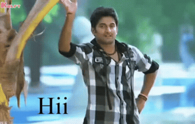 Man In Plaid Shirt Waving In Front Of Tree GIF