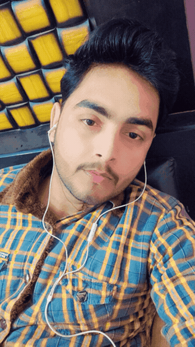 Man In Plaid Shirt Wearing Earbuds GIF