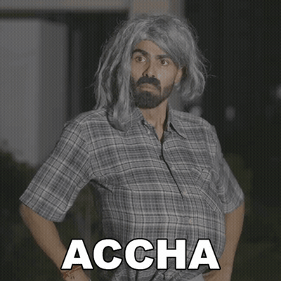 Man In Plaid Shirt With Accha On Chest GIF