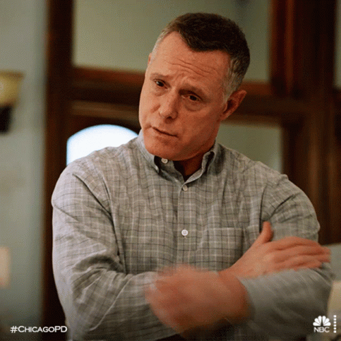 Man In Plaid Shirt With Arms Crossed And #Chicagopd GIF