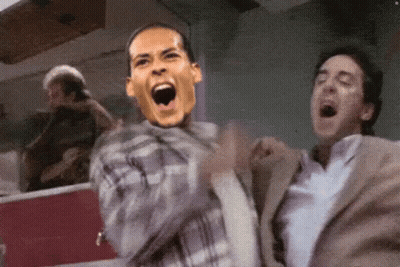 Man In Plaid Shirt With Face On Back GIF