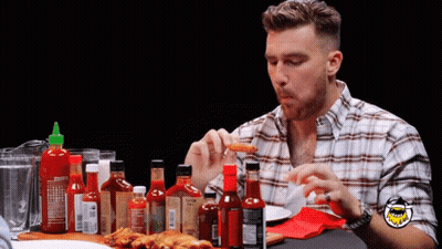 Man In Plaid Shirt With Hot Sauces GIF