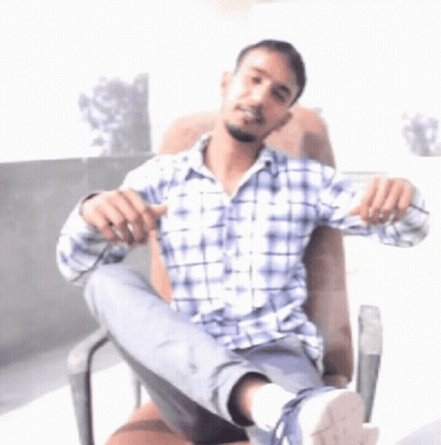 Man In Plaid Shirt With Leg Up GIF