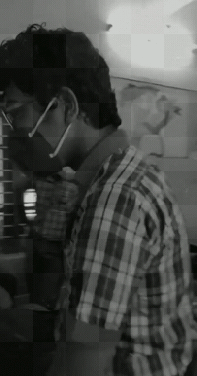 Man In Plaid Shirt With Mask And Glasses GIF