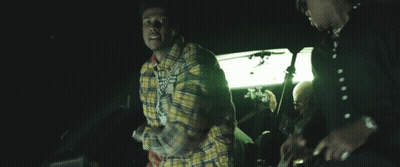 Man In Plaid Shirt With Snoop Dogg Badge GIF