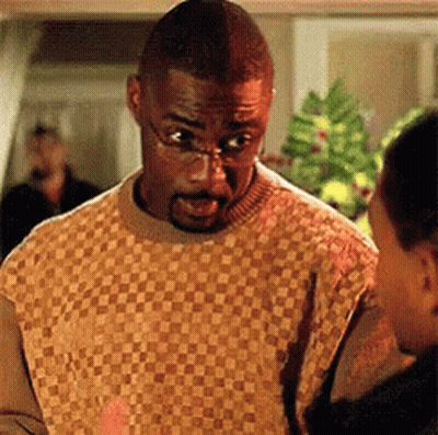 Man In Plaid Sweater And Glasses Talking To Another GIF