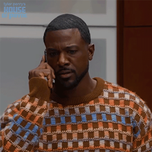 Man In Plaid Sweater On Phone With Tyler Perry's House Of Prime GIF