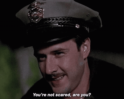 Man In Police Hat Asking If Not Scared GIF