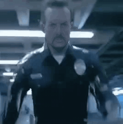 Man In Police Uniform Standing GIF