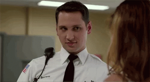 Man In Police Uniform Talking To Woman GIF