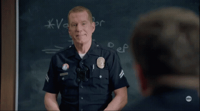 Man In Police Uniform With Los Angeles Police Department Badge GIF