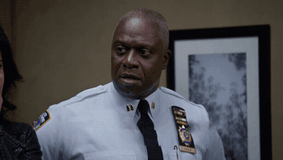Man In Police Uniform With Wolf Name Tag GIF