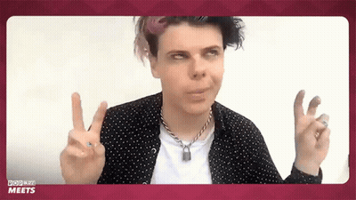 Man In Polka Dot Shirt Giving Peace Sign GIF