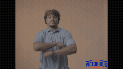 Man In Polo Shirt Pointing Victorious GIF