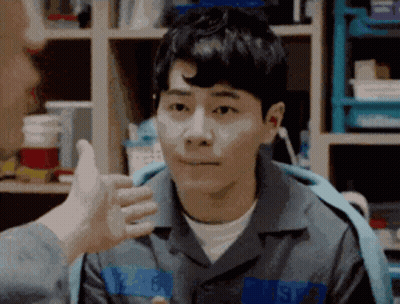 Man In Prison Uniform Giving Thumbs Up GIF