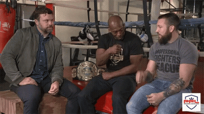 Man In Professional Fighters League T-Shirt With Two Men GIF