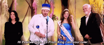 Man In Prom King Costume Next To Woman In Blue Dress And Suit GIF