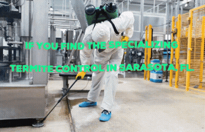Man In Protective Suit Spraying Floor GIF