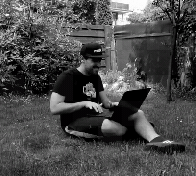 Man In Puma Hat Using Laptop GIF