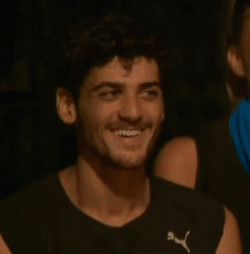 Man In Puma Shirt Sitting Next To Woman GIF