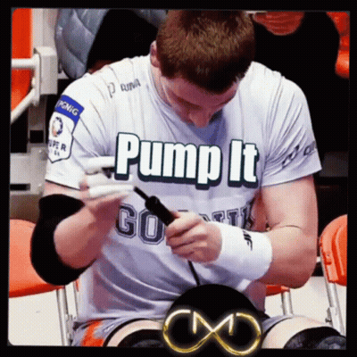 Man in Pump It Shirt Sitting in Chair