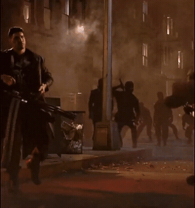 Man In Punisher Costume Holding Gun GIF