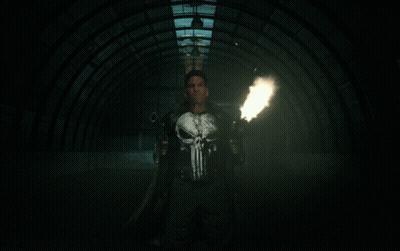 Man In Punisher Shirt Holding Guns GIF