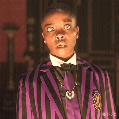 Man In Purple And Black Striped Suit With Netflix Logo GIF