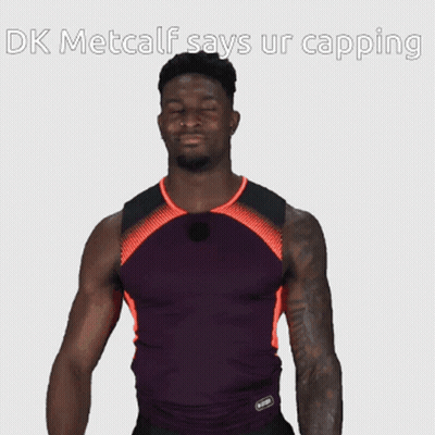 Man In Purple And Orange Shirt Says DK Metcalf Says Ur Capping GIF