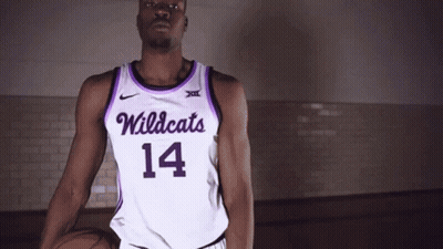 Man In Purple And White Wildcats Jersey Holding Basketball GIF