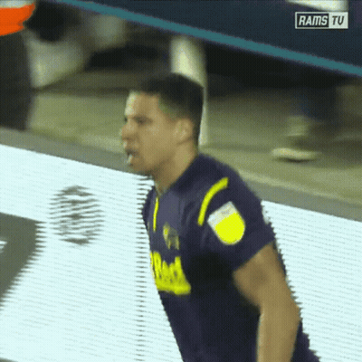 Man In Purple And Yellow Jersey On Rams TV Screen GIF