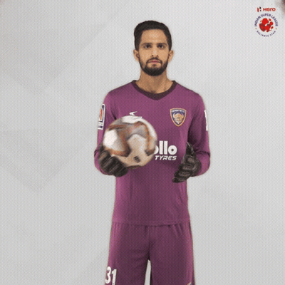 Man In Purple Apollo Tyres Jersey Holding Soccer Ball GIF