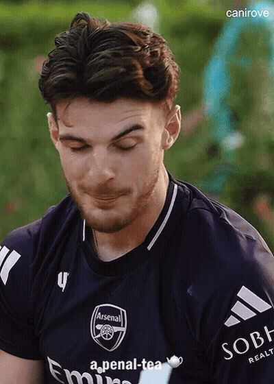 Man In Purple Arsenal Jersey Looking Down GIF