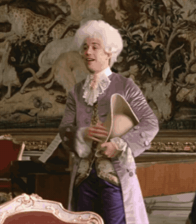 Man In Purple Coat And White Wig Holding Book GIF