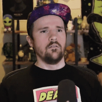 Man in Purple Hat and Black Shirt Saying Dead