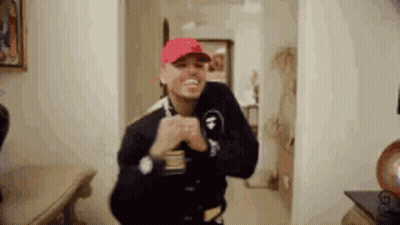 Man In Purple Hat Playing Video Game GIF
