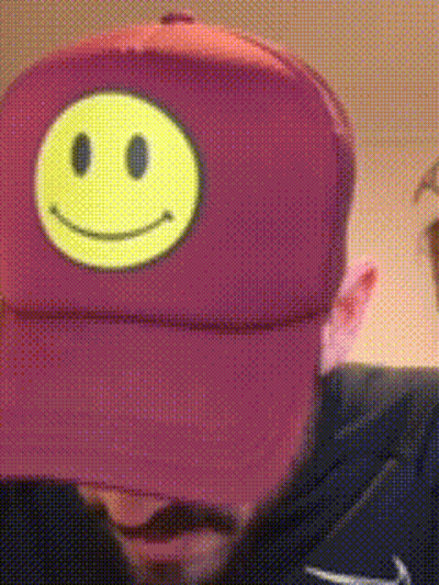 Man In Purple Hat With Smiley Face GIF