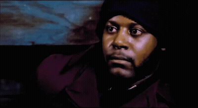 Man In Purple Jacket And Blue Hat Close Up GIF