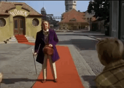 Man In Purple Jacket And Top Hat Holding Jar GIF
