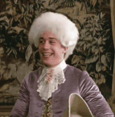 Man In Purple Jacket And White Wig Smiling GIF